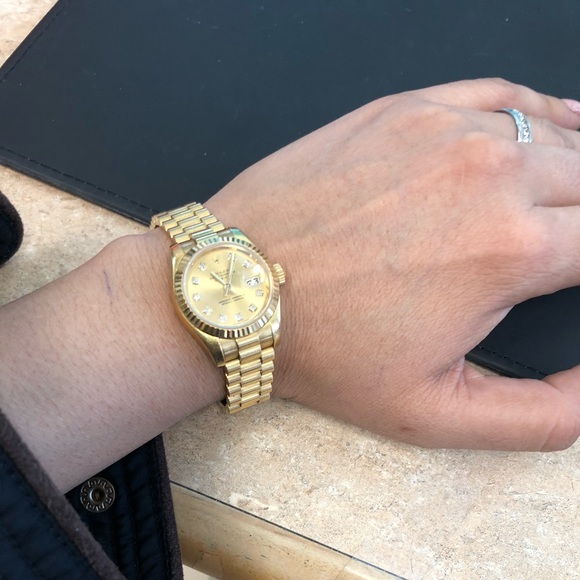 Gold Rolex woman watch